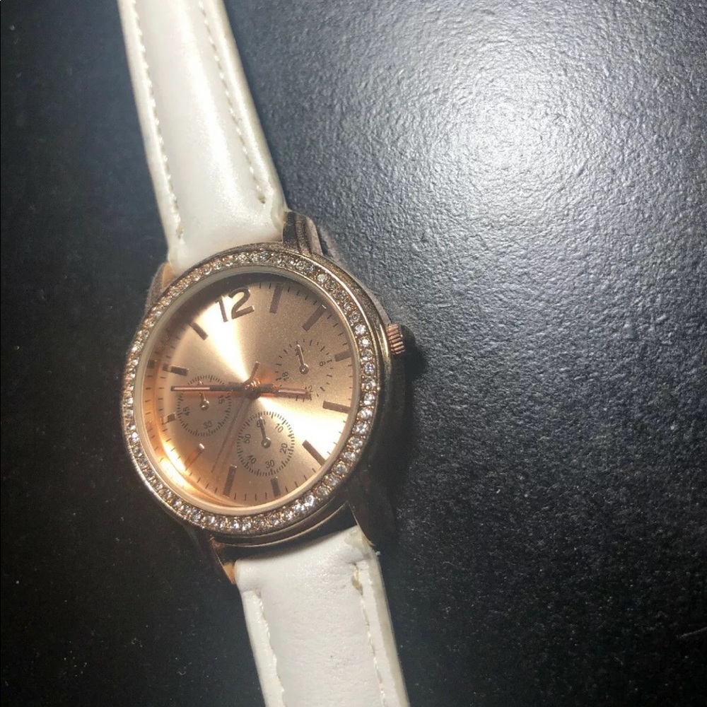 White watch with gold plate